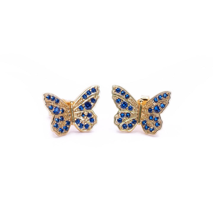 Pendientes de mariposa con circones azul oscuro.