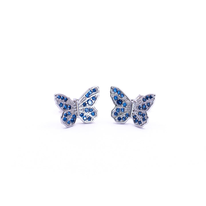 Pendientes de mariposa con circones azul oscuro.