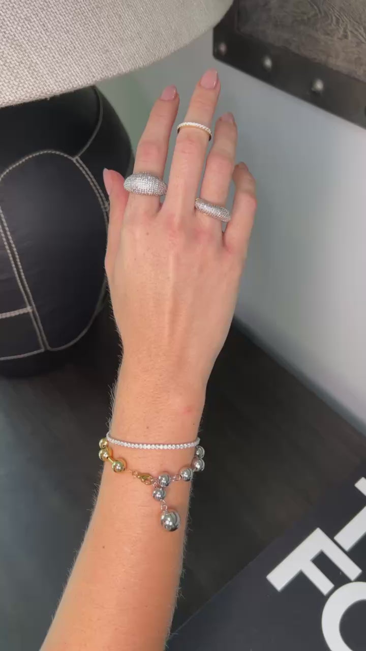 Pulsera doble tono bolas infinito.