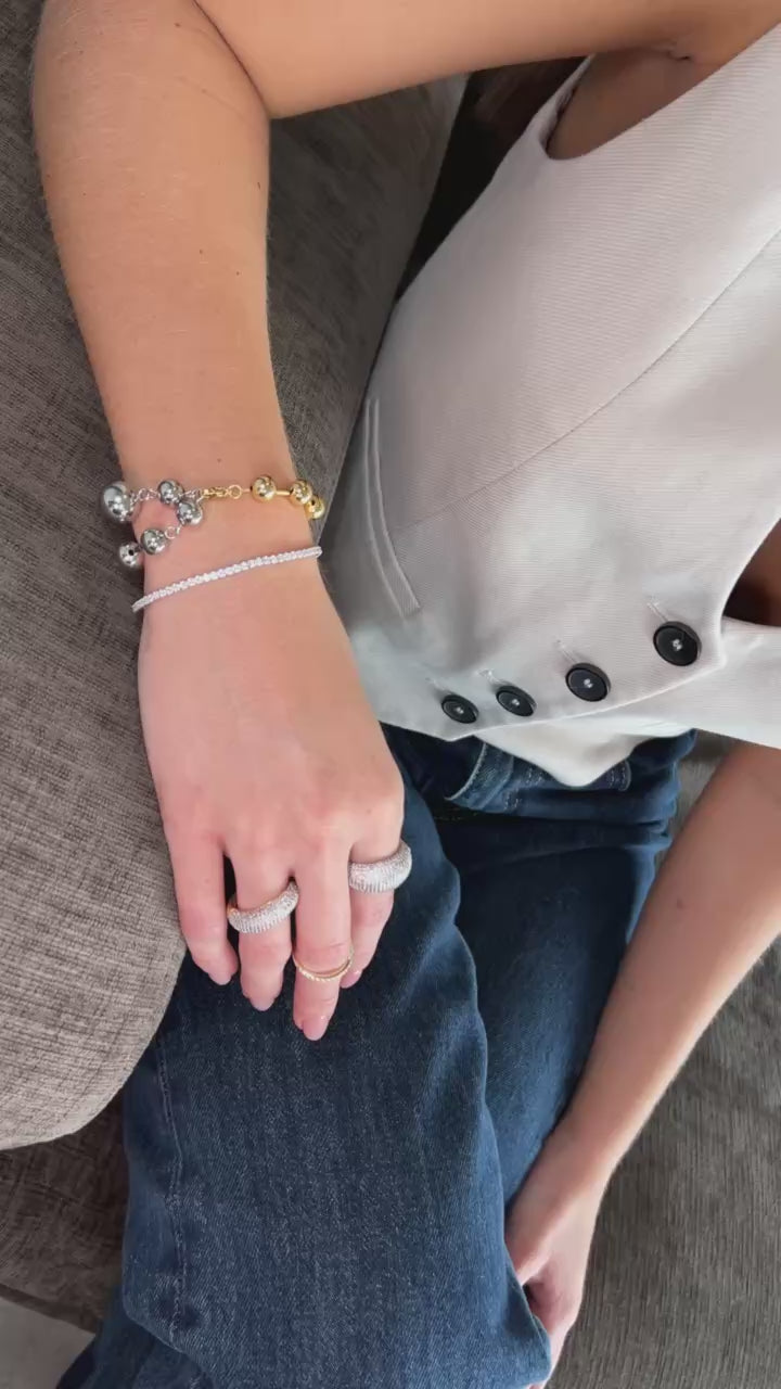 Pulsera doble tono bolas infinito.